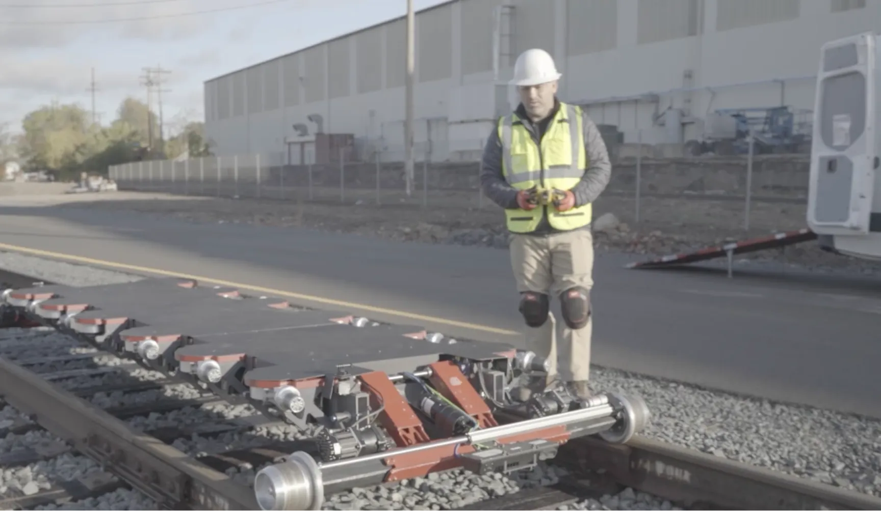 Wabtec Worker examining a Rail Ghost on the track