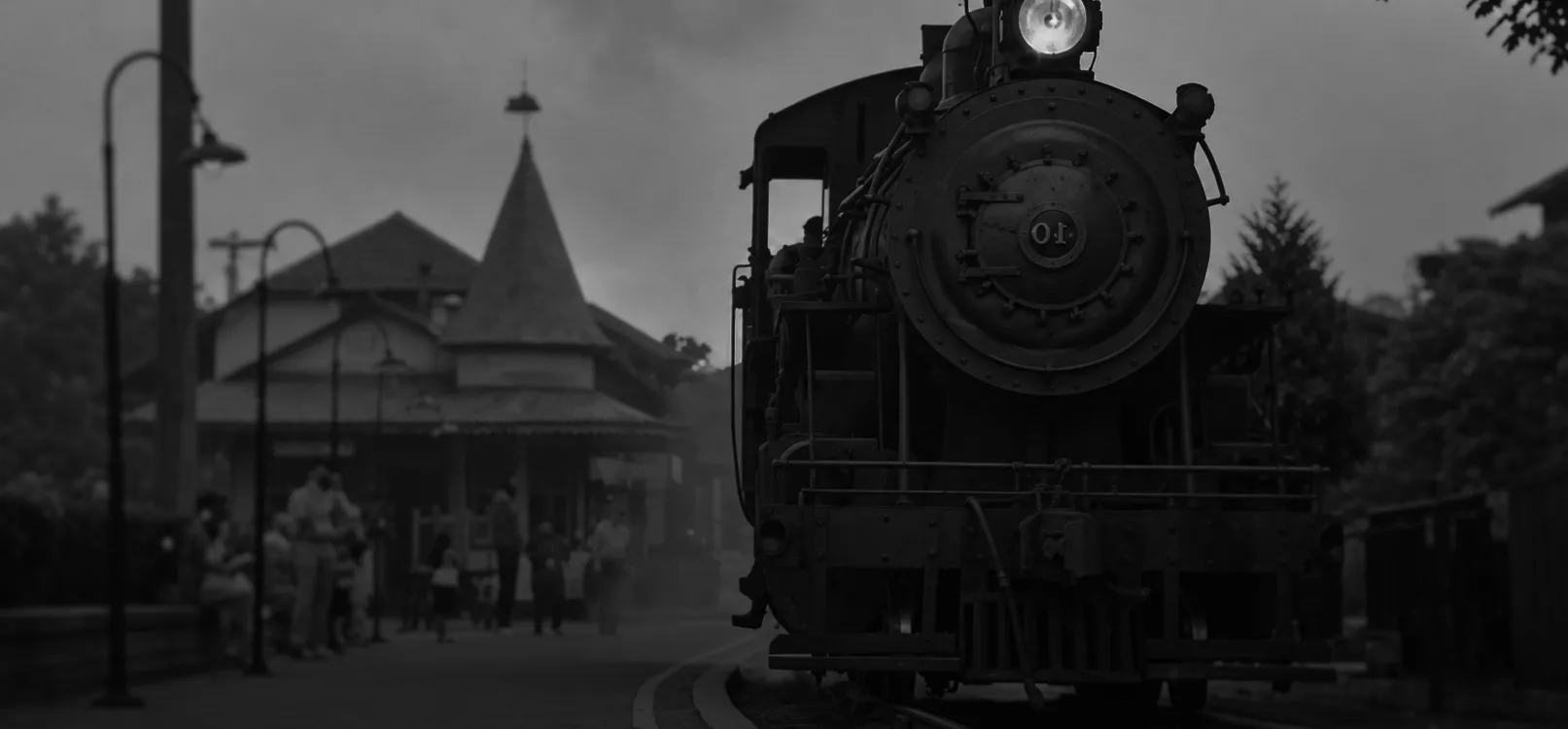 Historic steam locomotive at a train station