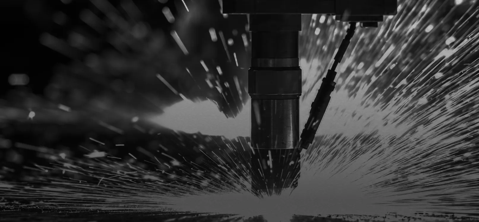 Rail manufacturing equipment producing sparks during testing