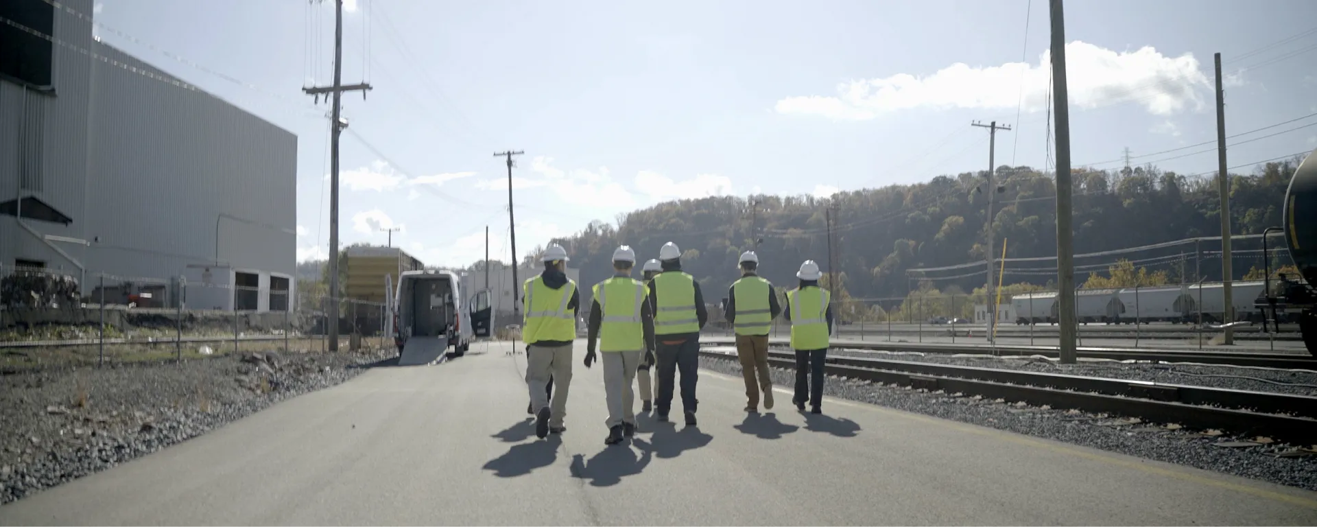 Forgeworks team walking through an active rail yard